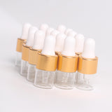 Maxbell 15 Pieces Glass Dropping Bottles Portable Refillable for Perfume Storage 2ml Clear Golden