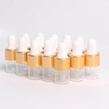 Maxbell 15 Pieces Glass Dropping Bottles Portable Refillable for Perfume Storage 2ml Clear Golden