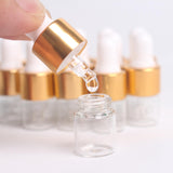 Maxbell 15 Pieces Glass Dropping Bottles Portable Refillable for Perfume Storage 2ml Clear Golden
